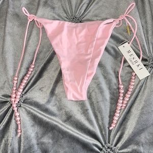 Swim bottoms with pearl accent